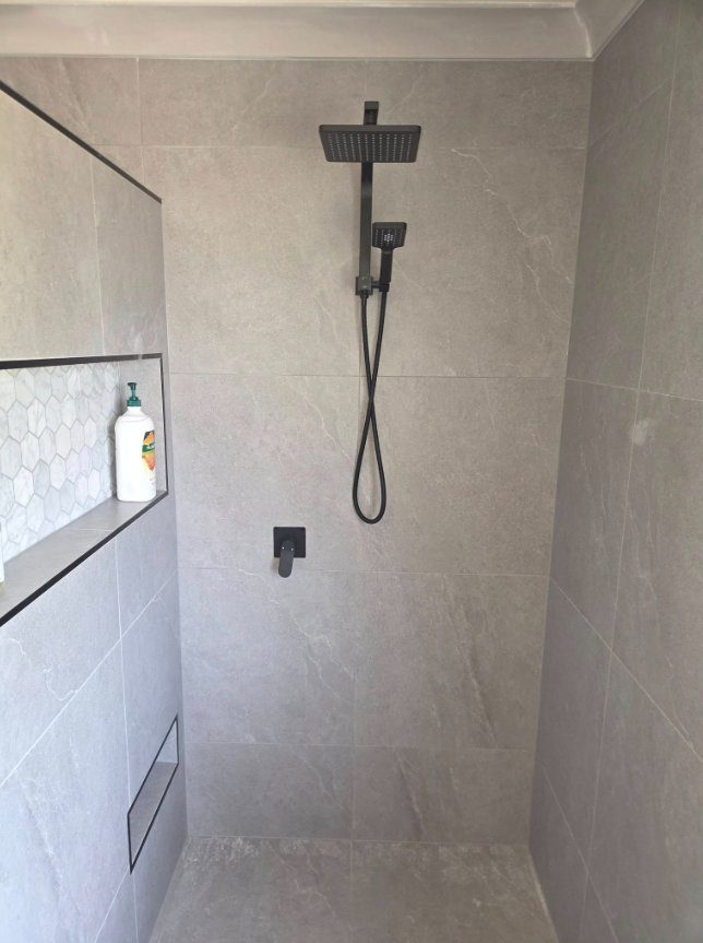 Tiled shower with matte black shower set